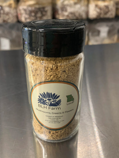 Jar of BLH Farm organic Reishi mushroom powder shaker