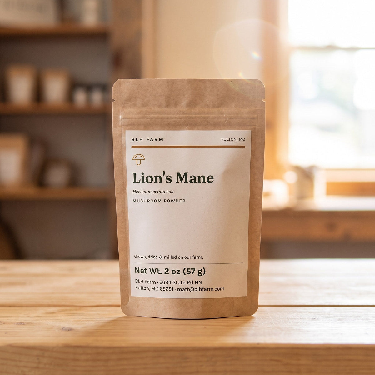 Lion's Mane mushroom powder 2 oz kraft pouch on a wood counter